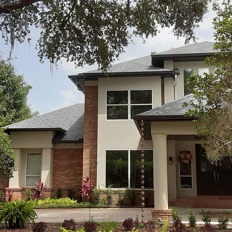 New Seamless Gutters and Rain Chain Installed on Beautiful Home in Tampa